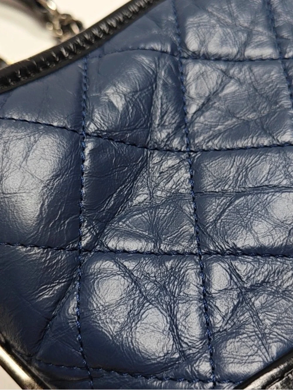 CHANEL Quilted Navy Leather Shoulder Bag with Black Trim and Gold CC Charm